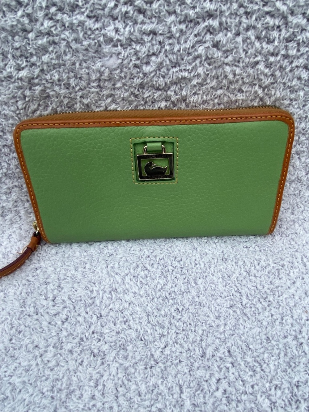 Dooney & Bourke multi-compartment zippered leather clutch green and tan